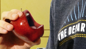 Apple with mouth close up